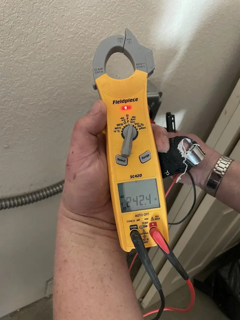 Voltage testing with clamp meter during Ceiling Fan Installation in Exeter